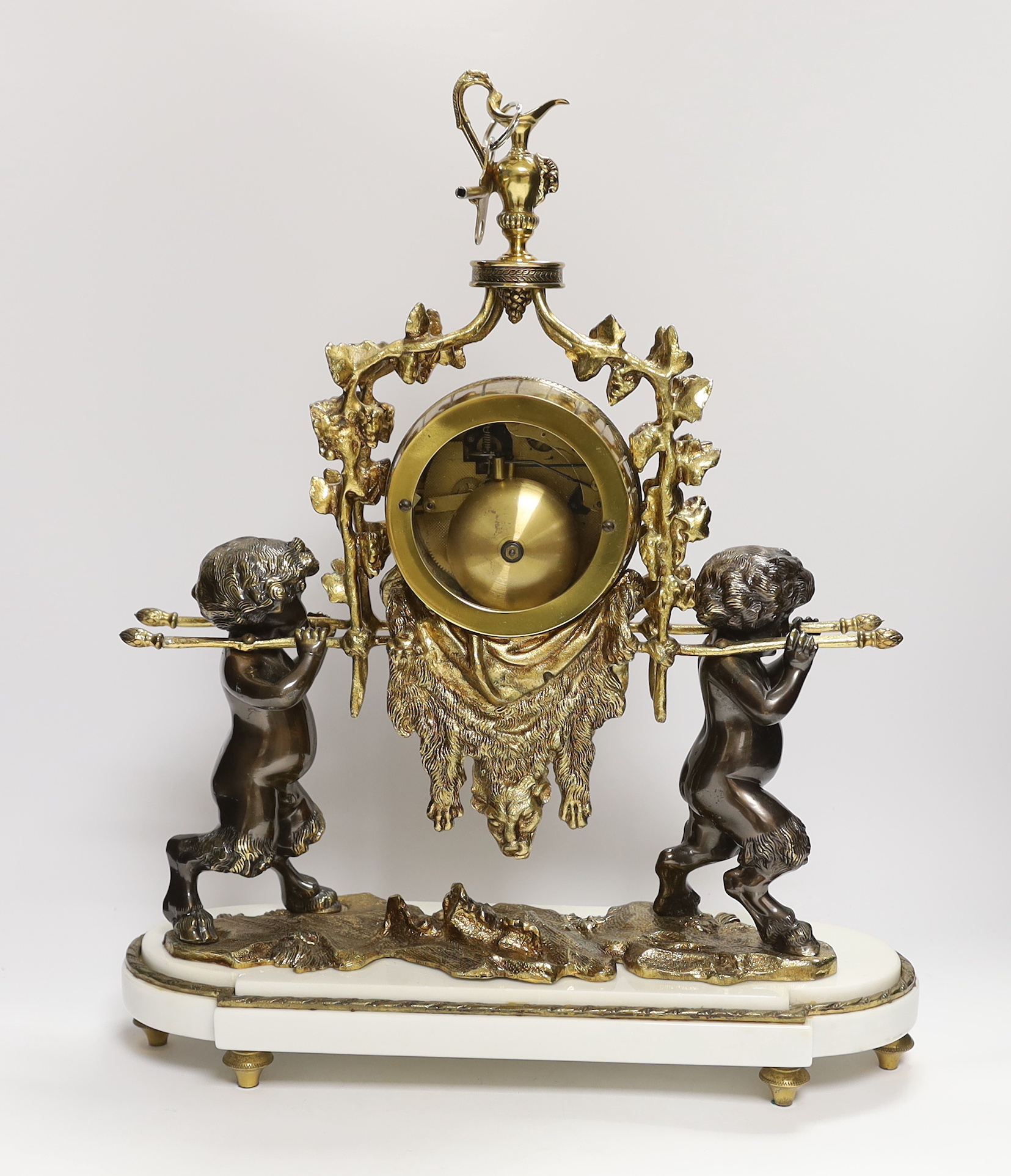 A period-style putti mantel clock (with key), 49cm high